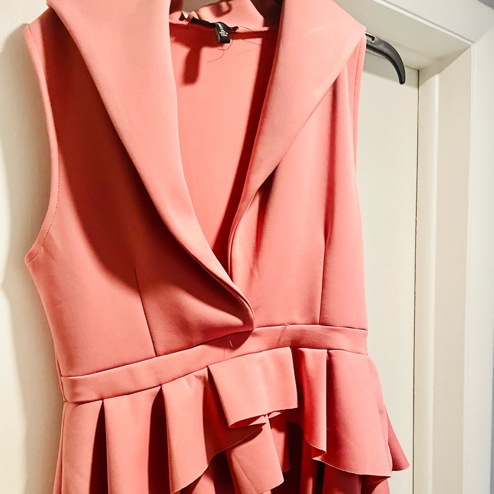 Fun top with peplum. Dress up or down!